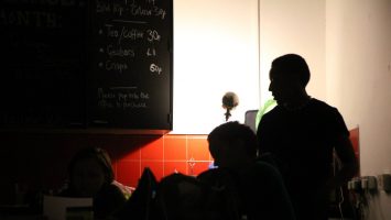 A figure sits in the darkened lounge of CDS